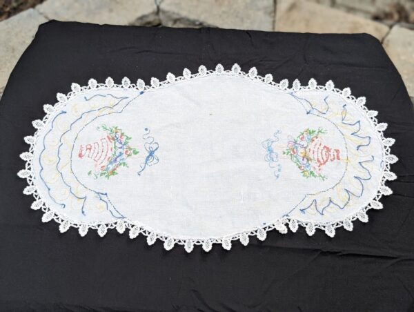 Vintage needlework table runner & doily set. Black runner, vibrant embroidered florals