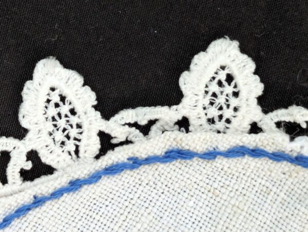 Vintage needlework table runner and doily set; intricate blue and white floral embroidery