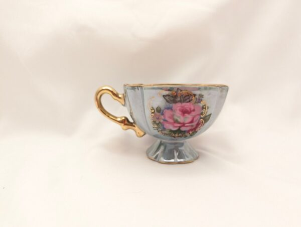 Blue teacup & saucer with hand-painted roses