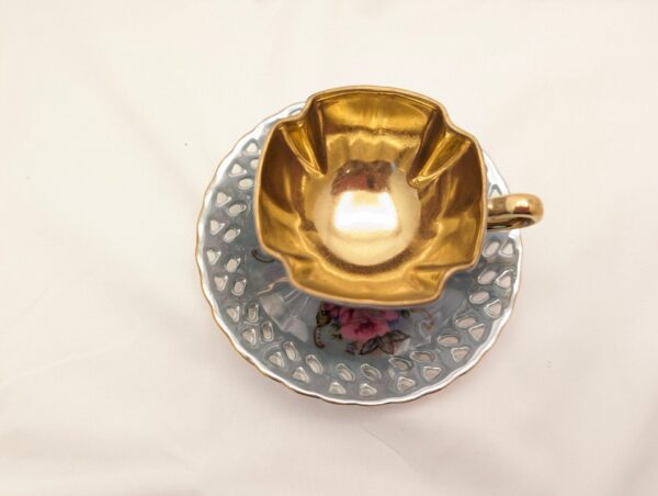 Vintage blue teacup with roses, gold details