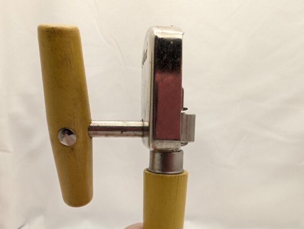 Vintage yellow-handled can opener