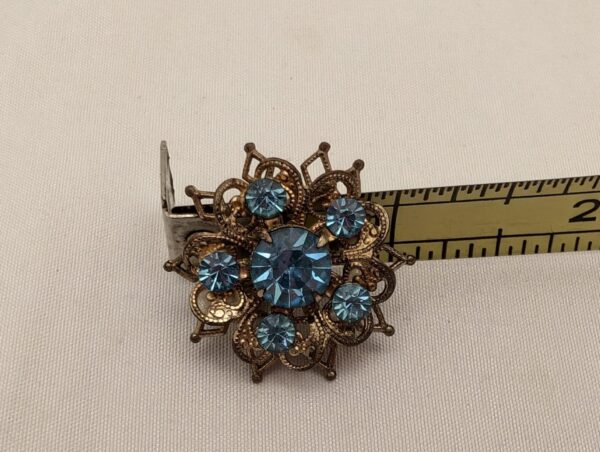 Vintage Brooch: Starburst Floral with Blue Rhinestones & Brass Filigree