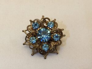 Vintage Mid-Century Brooch: Floral Starburst, Blue Rhinestones, Brass Filigree