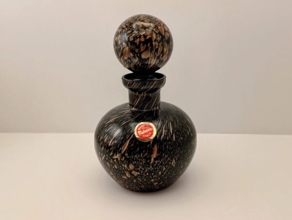 Murano glass decanter with aventurine-like pattern and copper accents